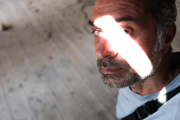 A close-up shot of a person examining a building's foundation with a flashlight, emphasizing the meticulous inspection process of due diligence. The lighting is focused and the person is wearing appropriate safety gear.