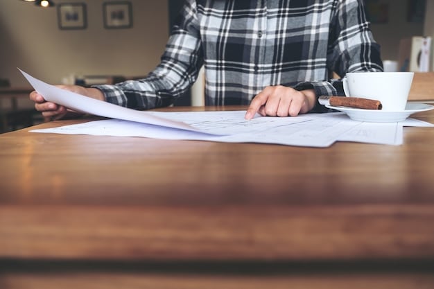A person reviewing legal documents at a desk, with a focus on contracts and property deeds, illustrating the legal component of due diligence. The scene is well-lit and professional.