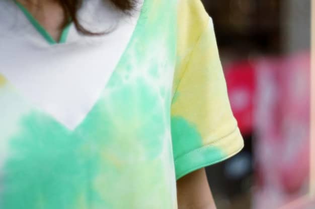 A close-up shot of a high-quality printed t-shirt showcasing a vibrant and detailed design. The fabric should appear soft and the print sharp, emphasizing the quality of print-on-demand products.